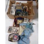 A box containing miscellaneous items to include silver bracelet, tins, wrist watch, hair clippers,