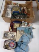 A box containing miscellaneous items to include silver bracelet, tins, wrist watch, hair clippers,