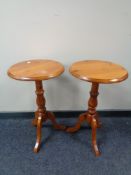 A pair of pine pedestal wine tables