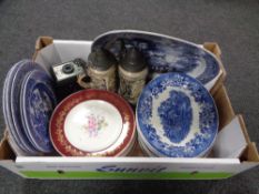 A box containing 19th century meat plate, beer steins, ironstone oval dishes, camera etc.