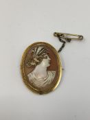 An antique gold cameo brooch