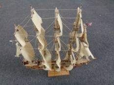 A wooden model of a five masted galleon.