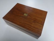 A 19th century satin wood fitted writing slope with ink well