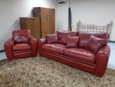 A Duresta red leather settee and armchair with scatter cushions