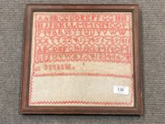 A Late 19'th Century sampler, 26 cm x 26 cm, with interesting hand-written note taped verso, framed.