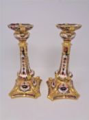 A pair of Royal Crown Derby Imari patterned candlesticks, number 1128, height 26.