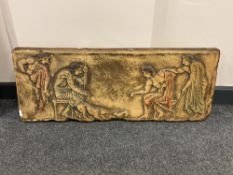 A plaster relief panel depicting figures with animals,