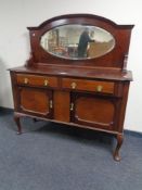 An Edwardian mahogany Queen Anne style mirror backed sideboard