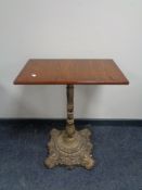 A pub table on cast iron base 60 cm x 35 cm