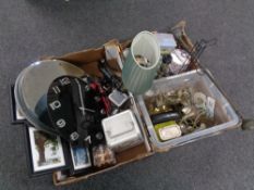 Two boxes containing miscellaneous items to include brass table lamp base, tins,