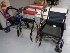 A folding light weight wheel chair together with three further mobility aids