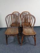 A set of four spindle backed kitchen chairs