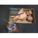 A box of vintage children's toys to include a Codeg cash register, doll's head, plastic doll,