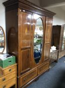 A 19th century inlaid mahogany mirror door wardrobe fitted two drawers beneath