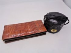 A vintage crocodile leather purse and a further tooled leather oval bag