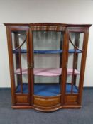 A nineteenth century mahogany triple door bow fronted display cabinet