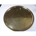 A circular brass eastern tray