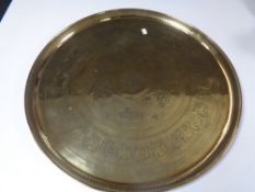 A circular brass eastern tray