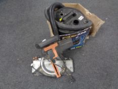 A boxed Work Zone Ash vac together with an Evolution compound miter saw.