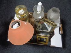 A box containing vintage cash boxes, dogs head shoehorn, brass oil lamp,sewing box,