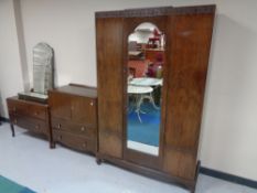 A twentieth century three piece bedroom suite comprising of wardrobe,