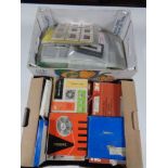 Two boxes of vintage film reels and projector slides