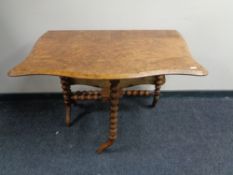 A Victorian walnut Sutherland table.