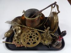 A tray of antique and later brass and copper ware to include dinner gong with beater,