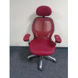 An ergonomic adjustable high backed office chair with head rest in purple mesh fabric