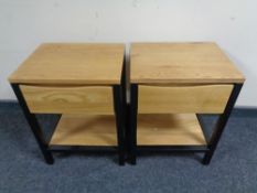 A pair of contemporary side tables, fitted a drawer, on metal legs.