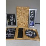 A large amount of wine and champagne corks on board together with five chalk boards in frames