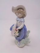 A Lladro figure - Girl with basket