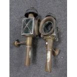 A pair of antique brass coach lamps.