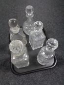A tray of five cut glass lead crystal decanters