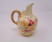 A Royal Worcester blush ivory gilded handled jug, height 13.