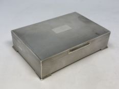 A good quality silver cigarette box with engine turned decoration,