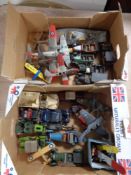 Two boxes of a quantity of plastic models to include boats, cars,