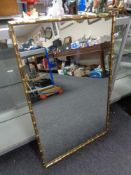 A gilt framed faux bamboo framed mirror