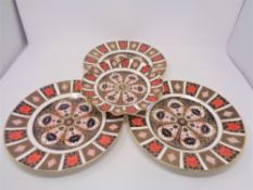 Three Royal Crown Derby Imari patterned plates,