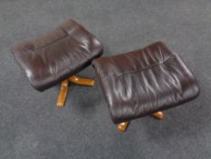 A pair of contemporary brown leather footstools on beech legs