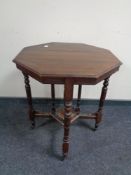 An Edwardian mahogany octagonal occasional table.