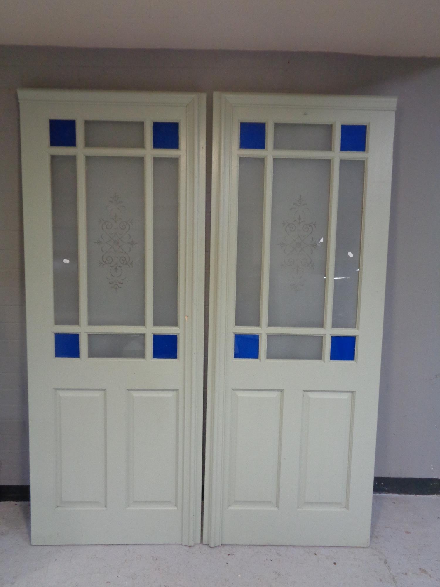 Two painted interior doors with coloured glass and etched glass panels, 198 x 76 cm.