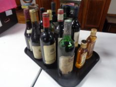 A tray containing ten assorted bottles of wine together with a bottle of Teacher's Highland Cream