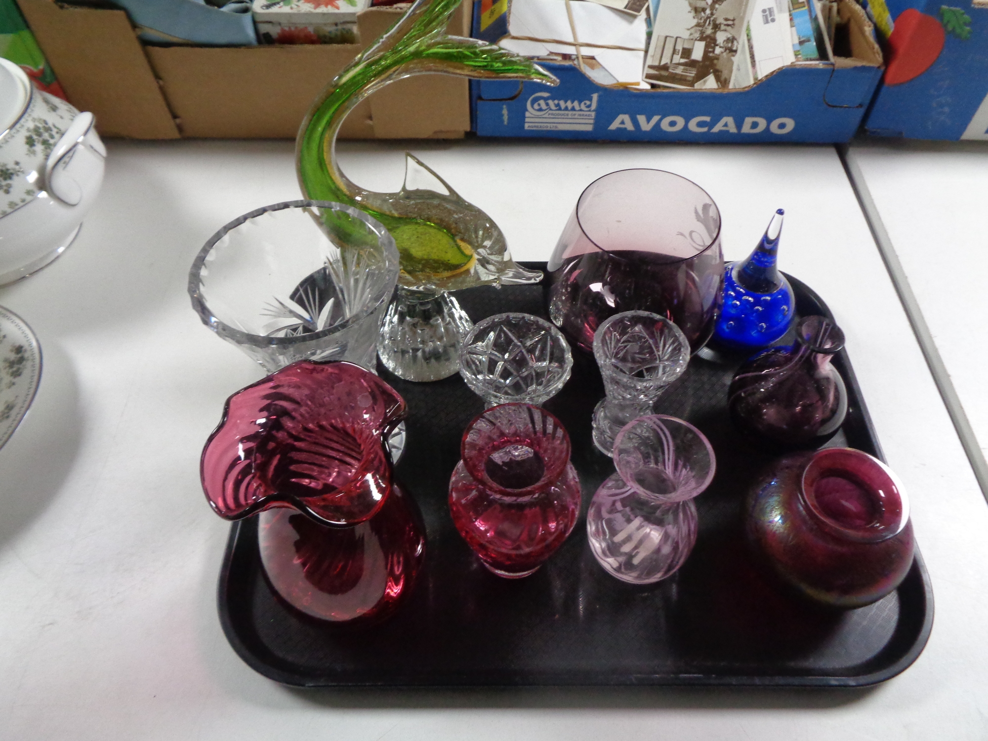 A tray containing assorted glassware to include Venetian glass fish, Caithness glass vases,