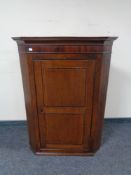 A George III hanging corner cabinet.