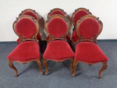 A set of six Victorian mahogany dining chairs in red fabric