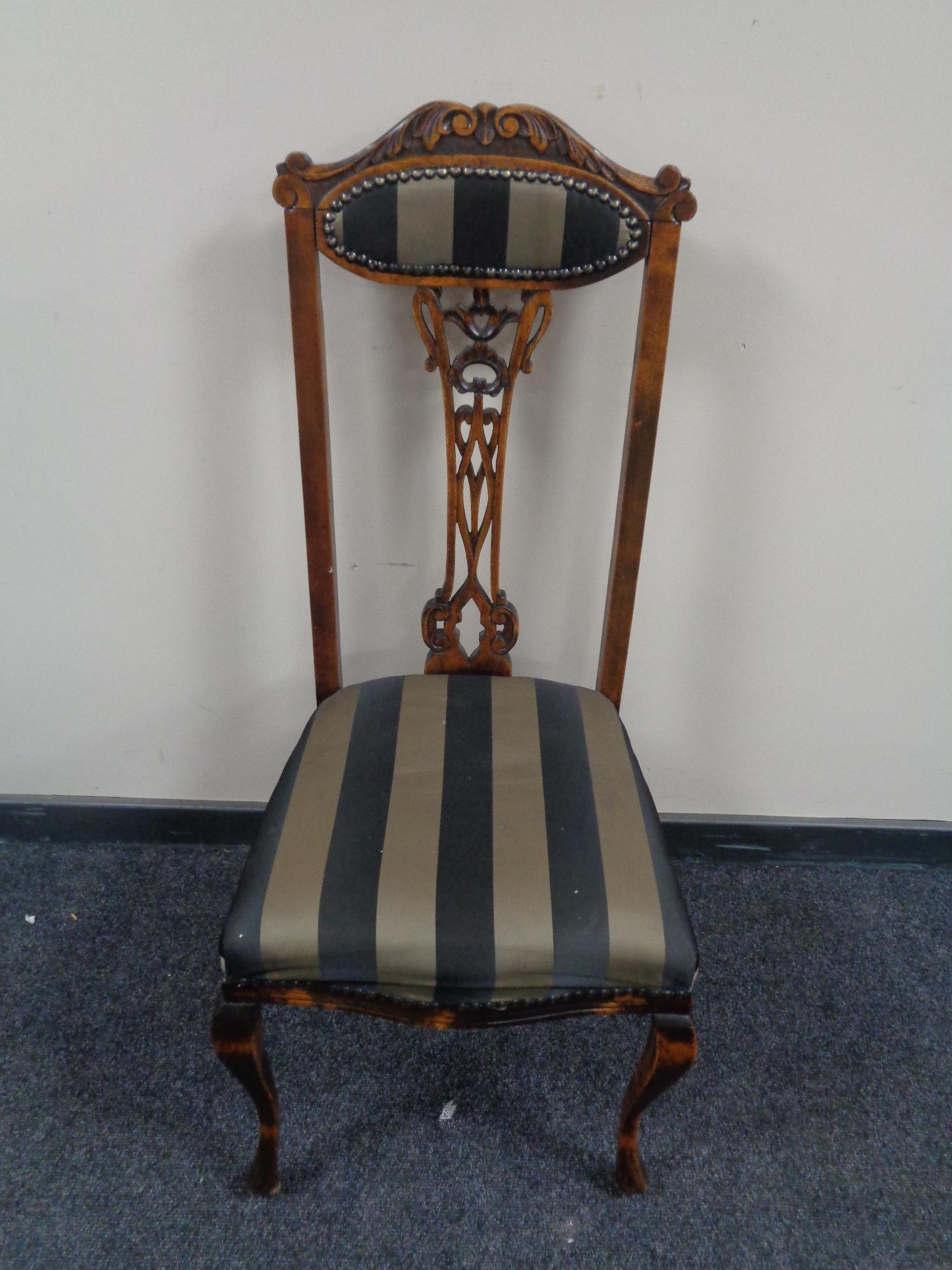 An Edwardian beech high backed occasional chair