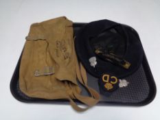 An Arp pouch cap and badges.