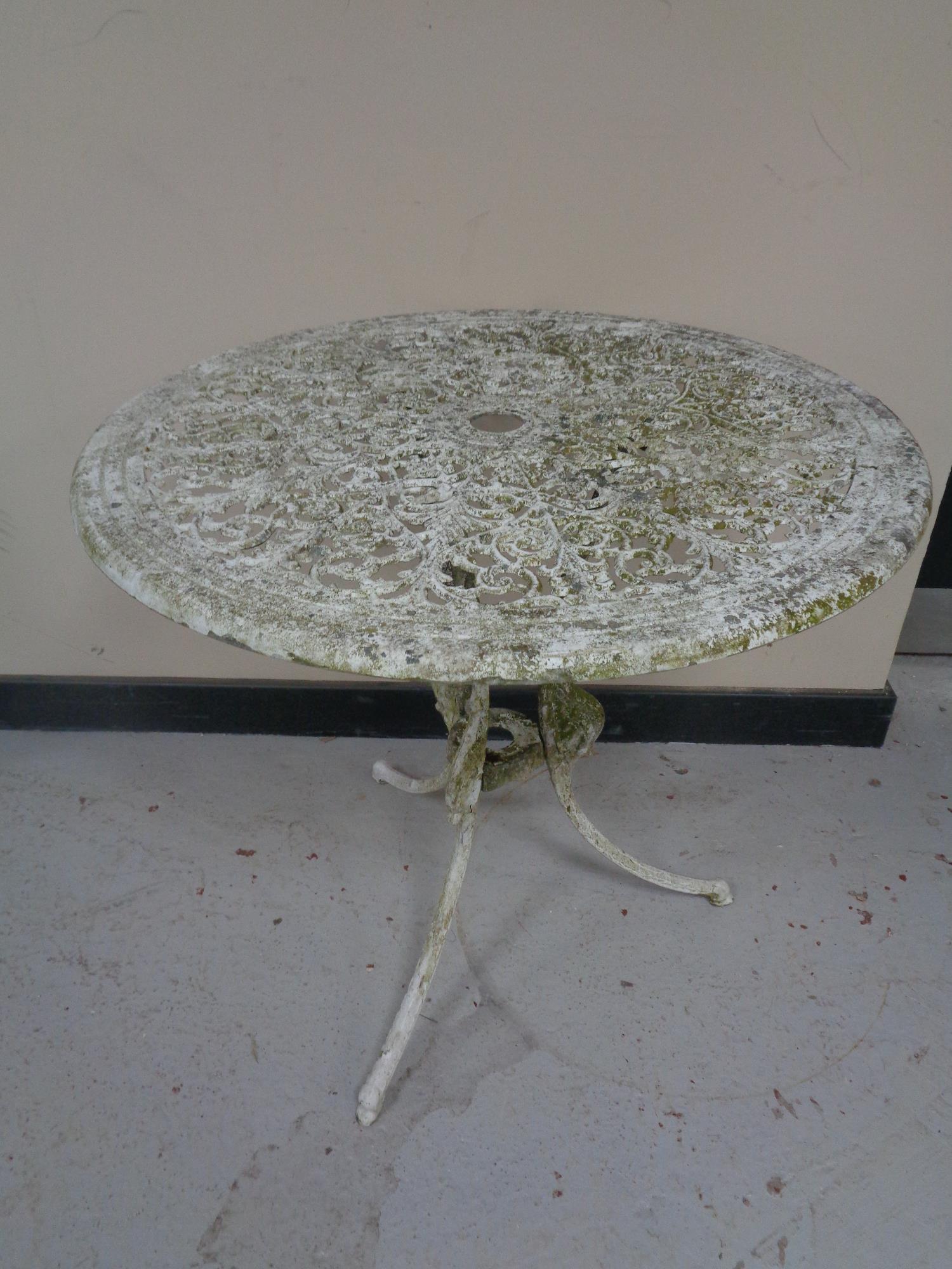 Two cast metal circular patio tables