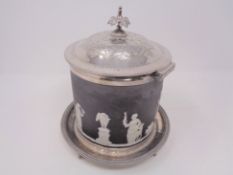 A Wedgwood Jasperware basalt biscuit barrel with plated lid and stand